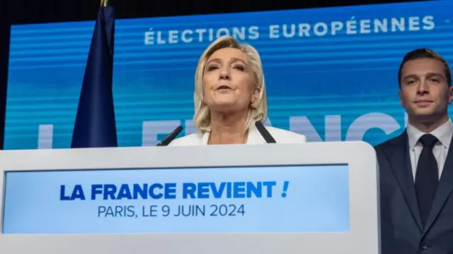 National Rally parliamentary party leader Marine Le Pen delivers with president Jordan Bardella last night