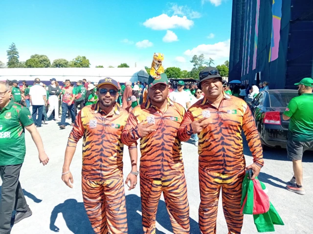 Three Bangladesh fans dressed as tigers