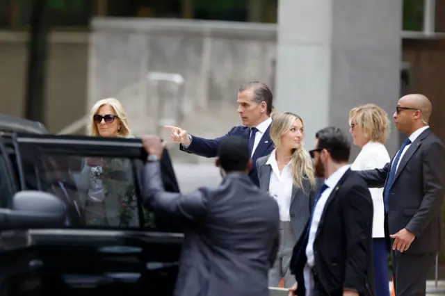 Hunter Biden gestures as he gets into a car outside a Delaware court