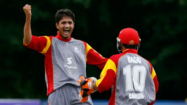 Canada cricketers celebrate a wicket