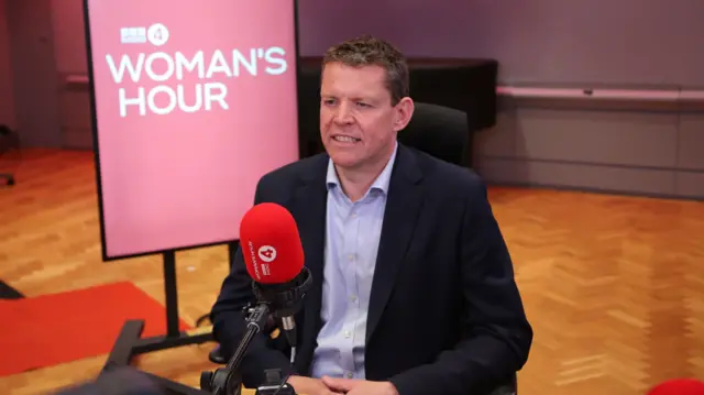 Rhun ap Iorwerth in the Woman's Hour studio in front of a microphone