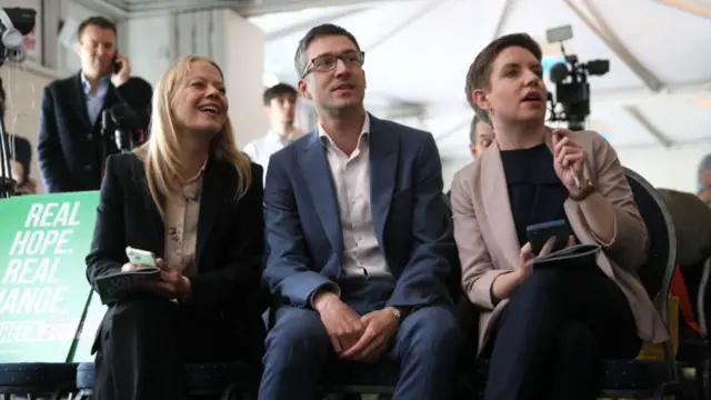 Sian Berry, Adrian Ramsay and Carla Denyer all sit in chairs ahead of the Green Party manifesto launch in Brighton.