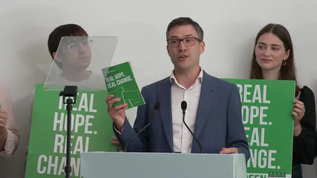 Adrian Ramsay from the Green Party holds a pamphlet that contains the Green Party manifesto.