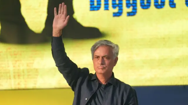 Jose Mourinho waves to fans as he is presented as the new Fenerbahce manager