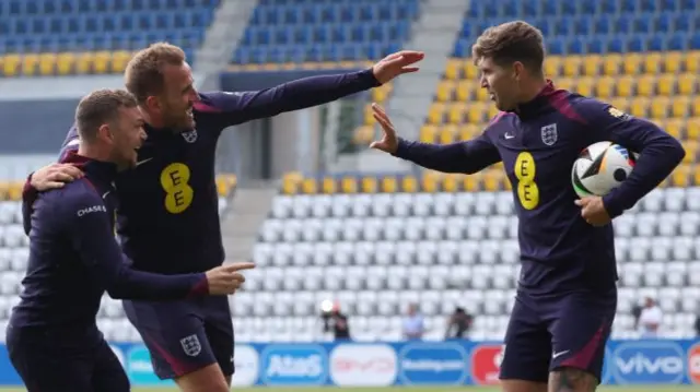 John Stones with Harry Kane and Kieran Trippier at England training on Tuesday