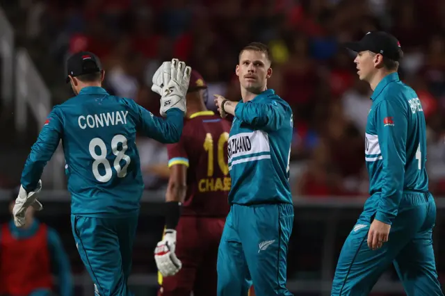 Lockie Ferguson celebrates the wicket of Roston Chase