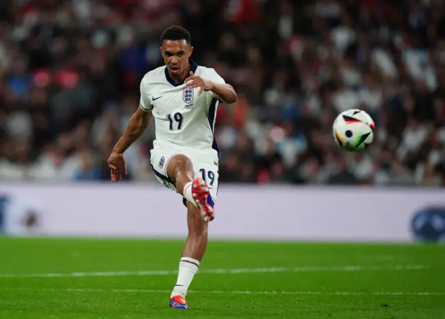 Trent Alexander-Arnold crosses the ball while playing for England against Iceland at Wembley