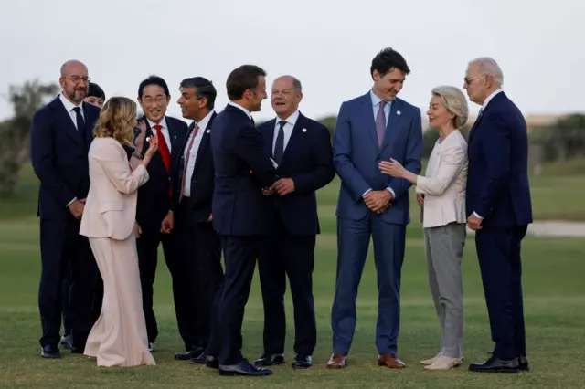 World leaders chat outside at the G7 summit in Italy