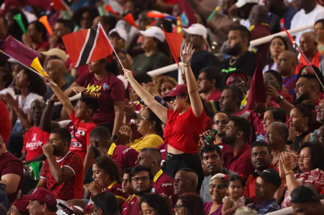 West Indies fans celebrate a boundary