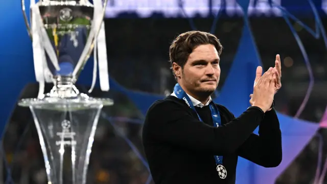 Edin Terzic applauds the Borussia Dortmund fans after receiving his runners-up medal following the 2024 Champions League final