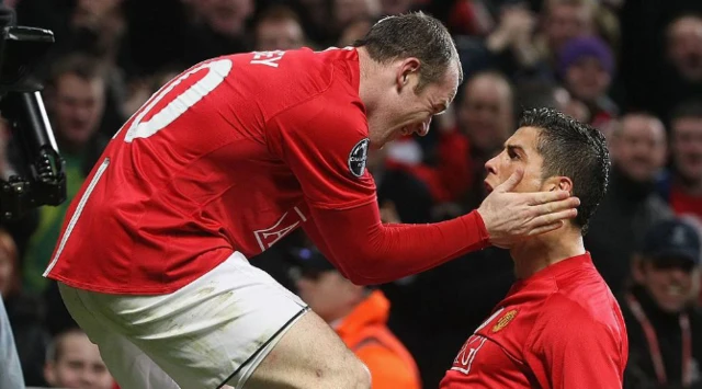 Wayne Rooney and Cristiano Ronaldo celebrate after a goal for Manchester United