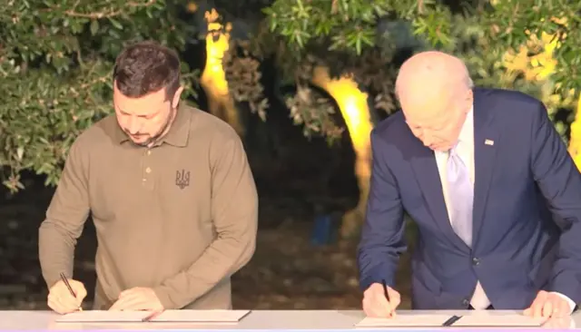 Zelensky and Biden sign deal