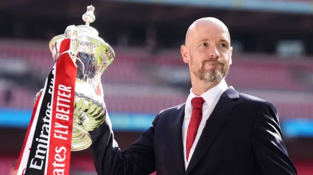 Manager Erik ten Hag holds aloft the FA Cup after Manchester United win the 2024 final