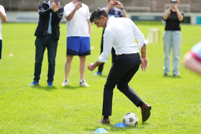 Rishi Sunak playing football