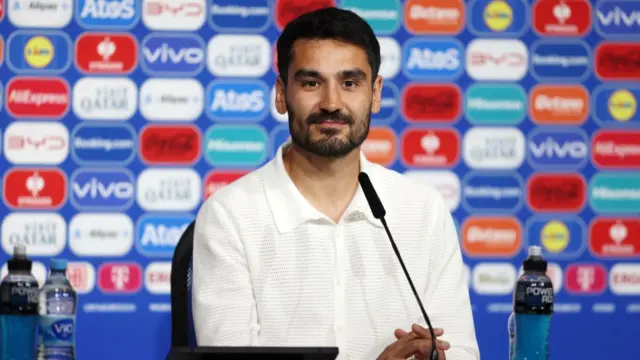 Germany midfielder Ilkay Gundogan speaking at a news conference before Euro 2024