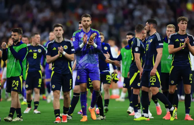 Scotland players applaud fans at full-time