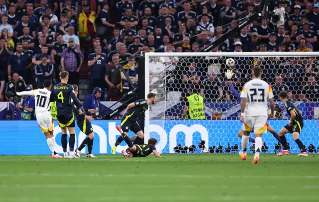 Jamal Musiala of Germany scores a goal to make it 2-0 during the UEFA EURO 2024 group stage match between Germany and Scotland at Munich Football Arena on June 14, 2024 in Munich, Germany.