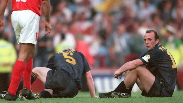 Gary McAllister looking dejected after Scotland fail to qualify from the group stage of Euro 1996