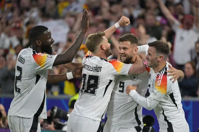 Niclas Fuellkrug (2R) celebrates with teammates after scoring his team's fourth goal during the UEFA Euro 2024 Group A football match between Germany and Scotland at the Munich Football Arena in Munich on June 14, 2024