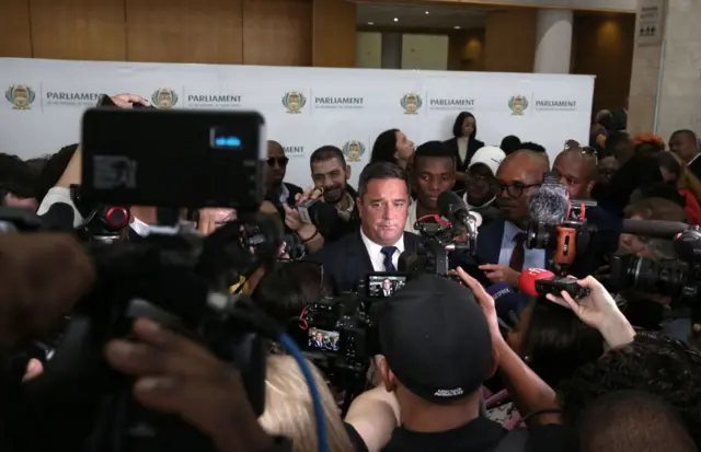 John Steenhuisen in a media scrum