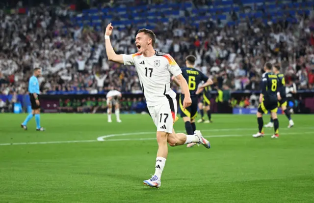 Florian Wirtz of Germany celebrates scoring his team's first goal during the UEFA EURO 2024 group stage match between Germany and Scotland at Munich Football Arena