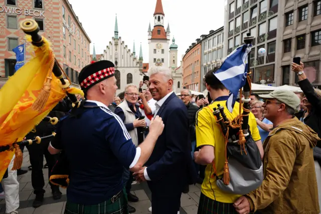 ayor of Munich Dieter Reiter (centre) with Scotland fans at Marienplatz square