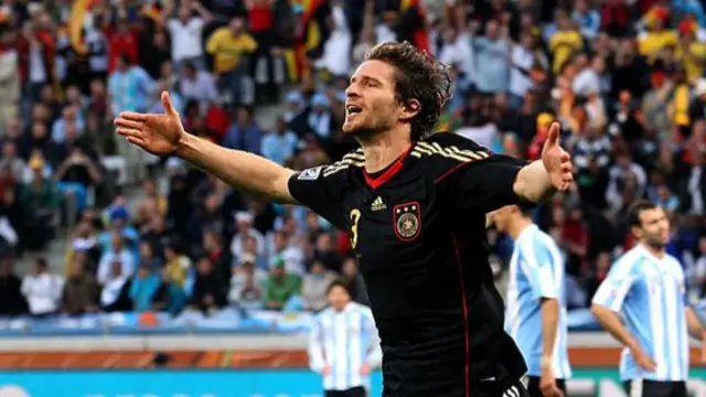 Arne Friedrich celebrates scoring for Germany against Argentina at the 2010 World Cup