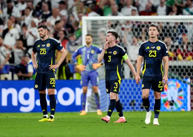 Scotland players look dejected in the Allianz Arena