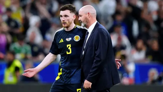 Andy Robertson in conversation with manager Steve Clarke