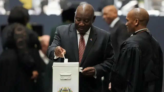 South African President Cyril Ramaphosa casts his ballot in a vote for the speaker of parliament during the first sitting of the National Assembly following elections, at the Cape Town International Convention Center (CTICC) in Cape Town, South Africa June 14, 2024