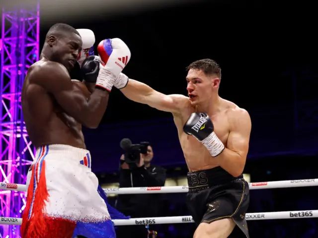 Chris Billam-Smith lands a right jab on Richard Riakporhe