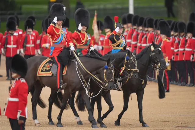 The Prince of Wales, Duke of Edinburgh and the Princess Royal salute from horseback