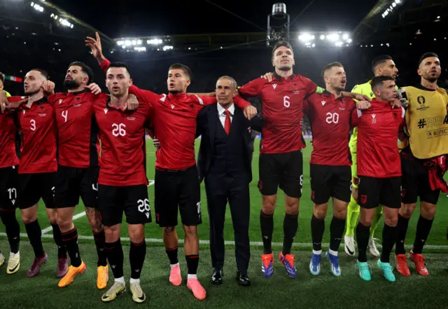 Albania players stand to appreciate their fans at full time