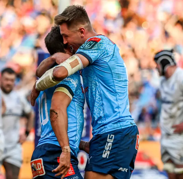 Bulls celebrate a try