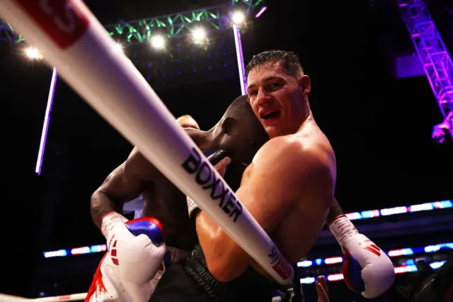 Richard Riakporhe and Chris Billam-Smith grapple on the ropes