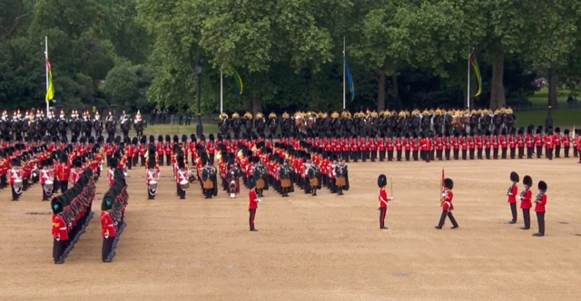 Trooping the Colour begins with soldiers passing a sword