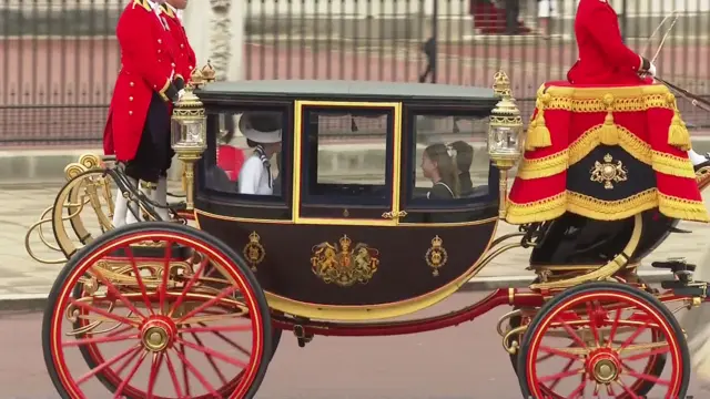 Kate inside the carriage with her children.