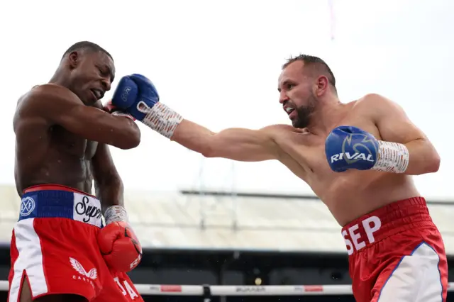 Dan Azeez evades a punch from Hrvoje Sep