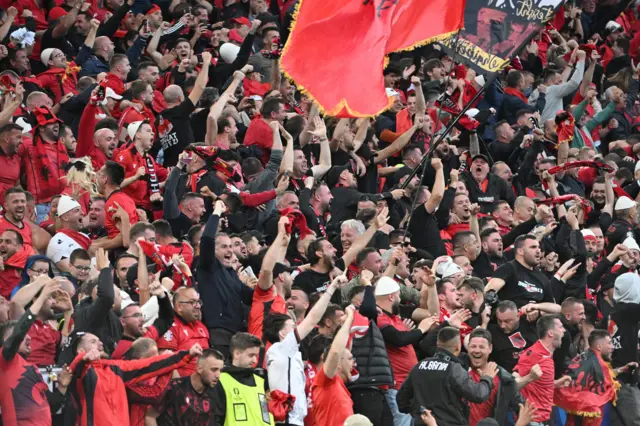 Albania fans roar on their side from the stands