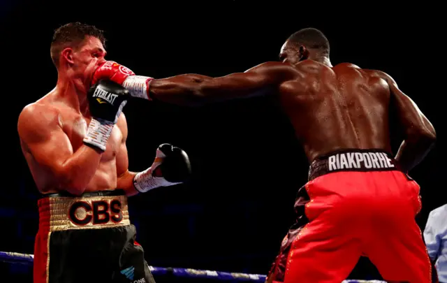 Richard Riakporhe lands a punch on the face of Chris Billam Smith