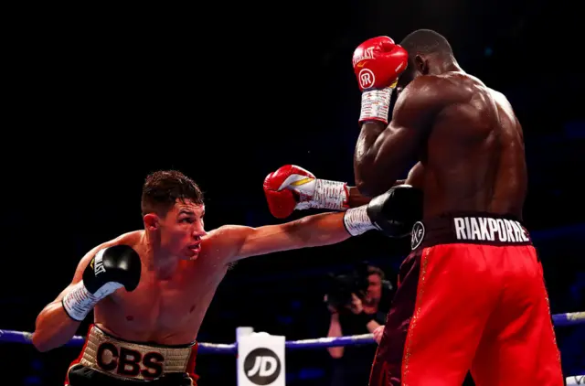 Chris Billam Smith throws a punch at Richard Riakporhe