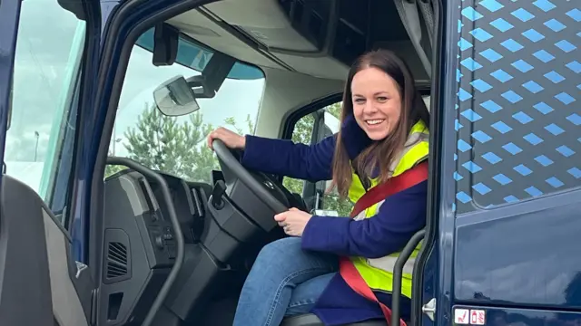 Kate Forbes at the wheel of a lorry