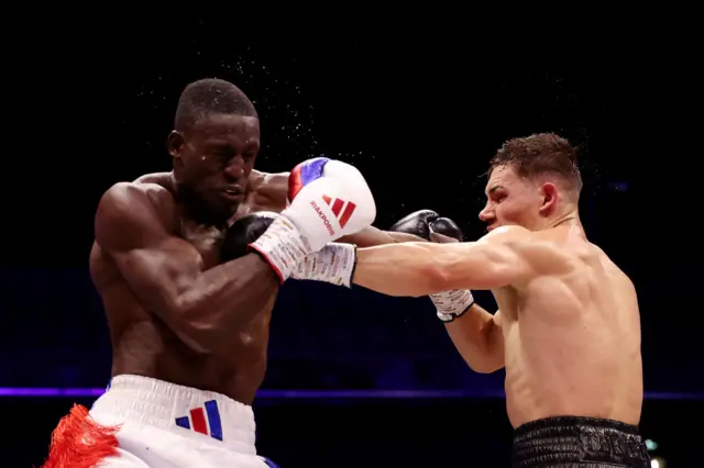 Chris Billam-Smith lands a left jab on Richard Riakporhe