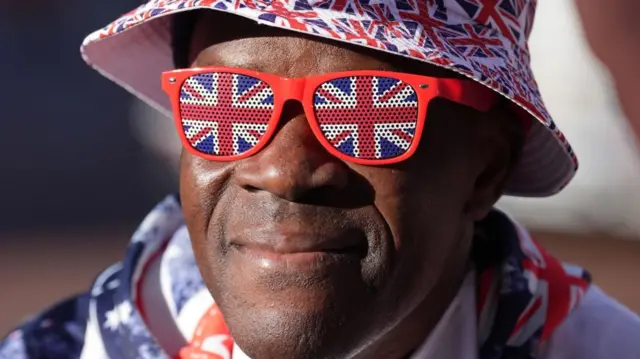 Joseph Afrane, a man who saw Princess of Wales, dressed in a Union Jack hat and scarf.