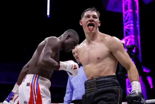 Chris Billam-Smith sticks his tongue out as a fight finishes