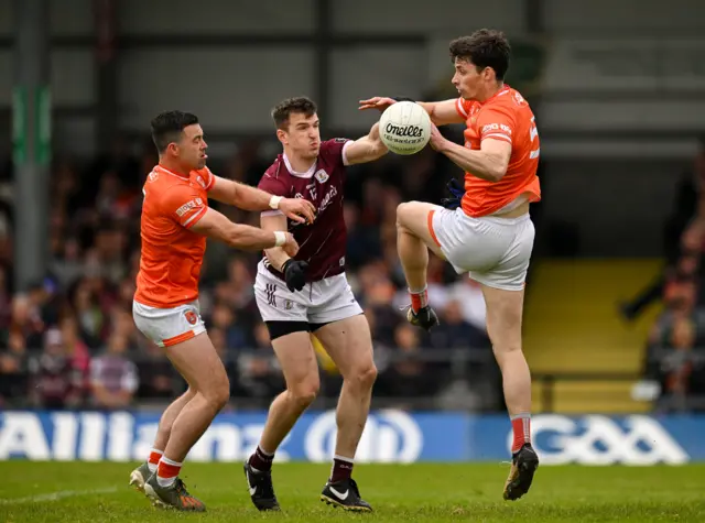 Ciaran Higgins and Aidan Forker of Armagh and Cein Darcy