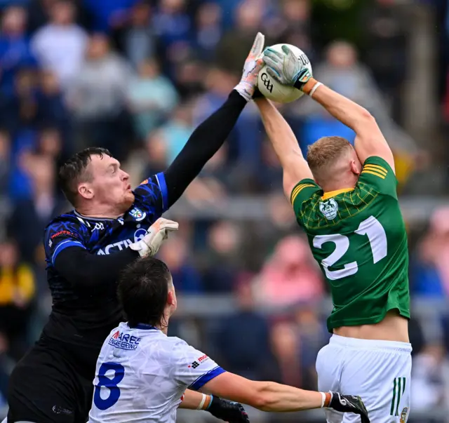 Rory Beggan challenges for the ball