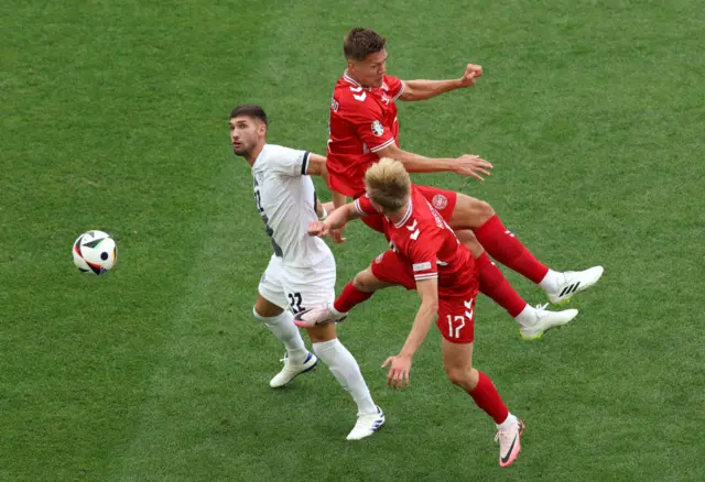 Jannik Vestergaard and Victor Kristiansen of Denmark compete for the ball