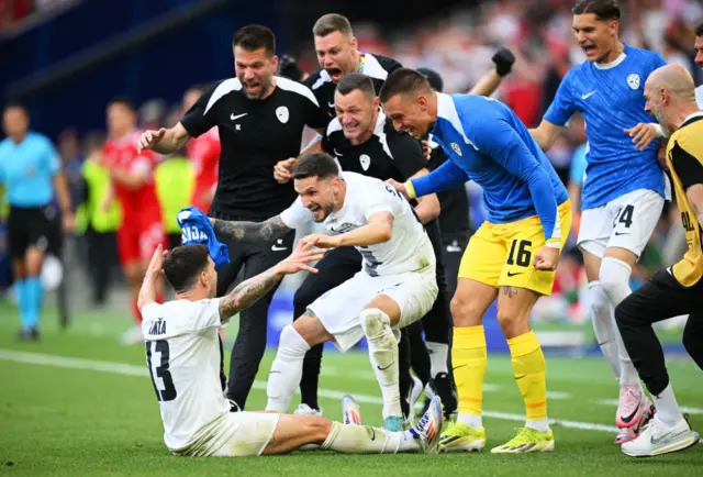 Slovenia celebrate scoring the equaliser against Denmark