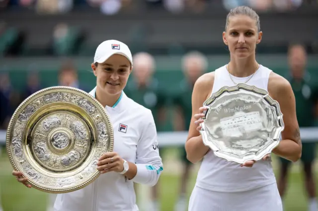 Pliskova and Barty hold their Wimbledon trophies after the Ladies' final of 2021